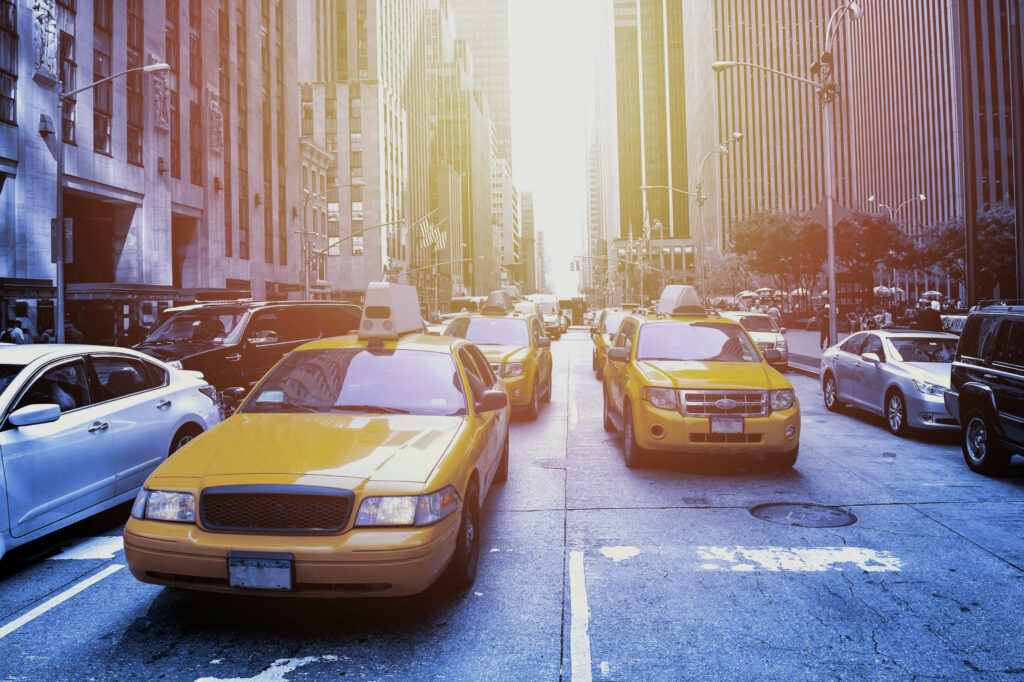 Yellow cab in a Black and White New York at sunset