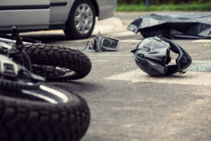 New Jersey motorcycle accident lawyer. Motorcycle and helmet on the street after dangerous traffic incident